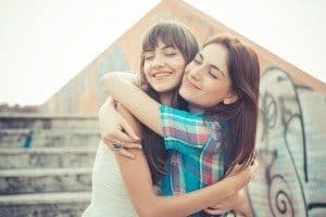 beautiful hipster young women sisters friends in the city